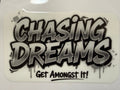 Sticker with 'Chasing Dreams Get Amongst It!' text on a white background