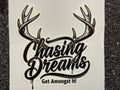 Sticker with antlers and 'Chasing Dreams Get Amongst It!' text on a white background